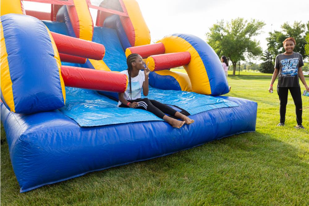 student on bounce house during Laker Kickoff